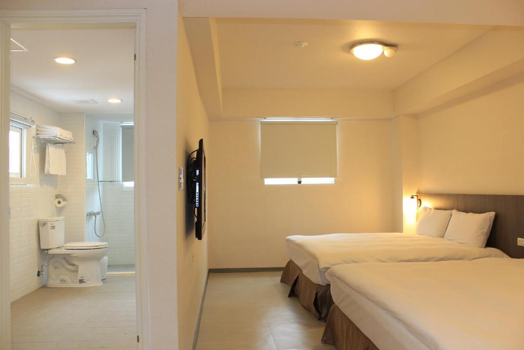 Postel nebo postele na pokoji v ubytování Sunnyside Hotel