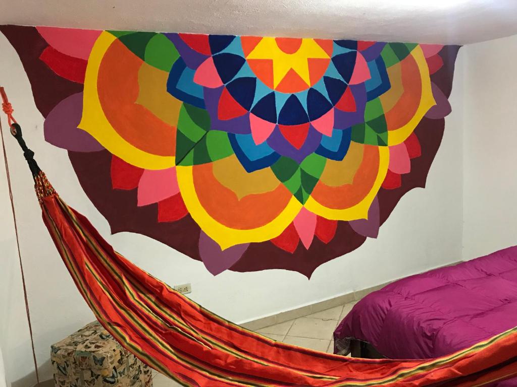 Postel nebo postele na pokoji v ubytování Hostal Casa Lantana