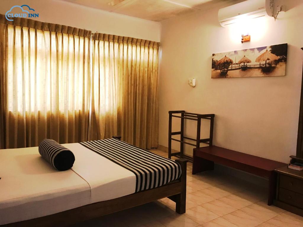 Postel nebo postele na pokoji v ubytování Cloud Inn Kandy Homestay