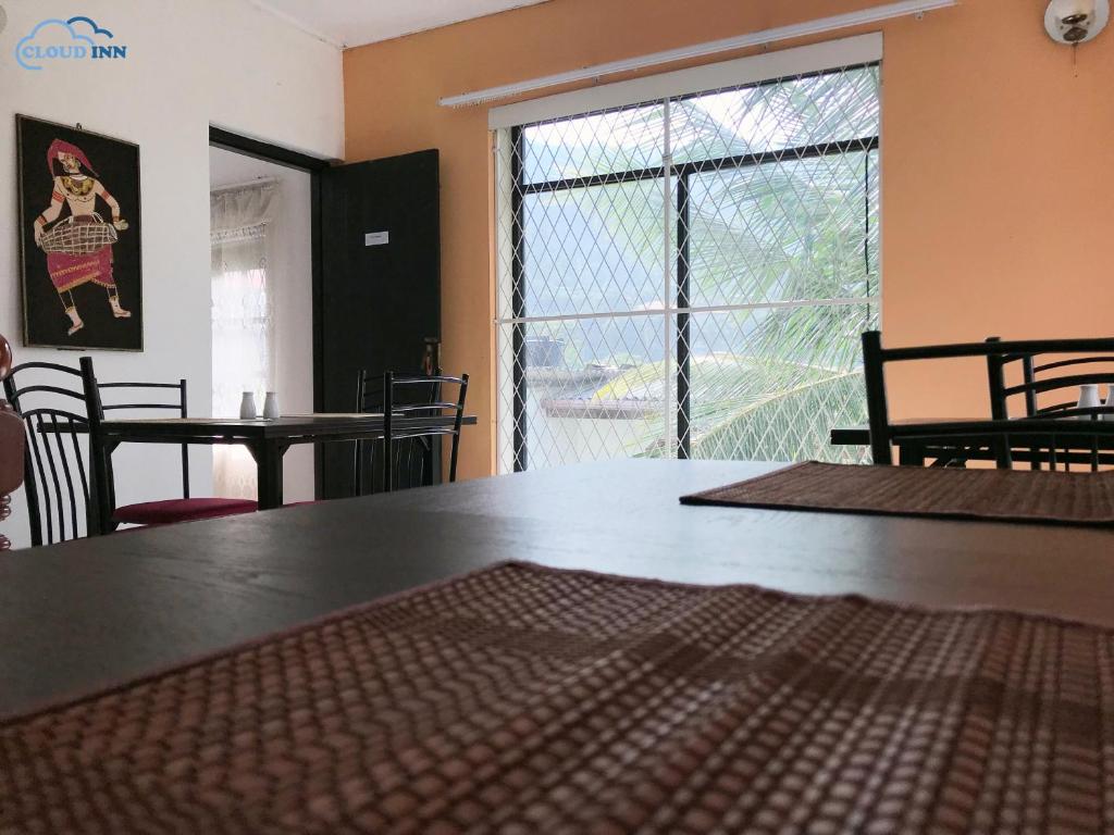 Postel nebo postele na pokoji v ubytování Cloud Inn Kandy Homestay