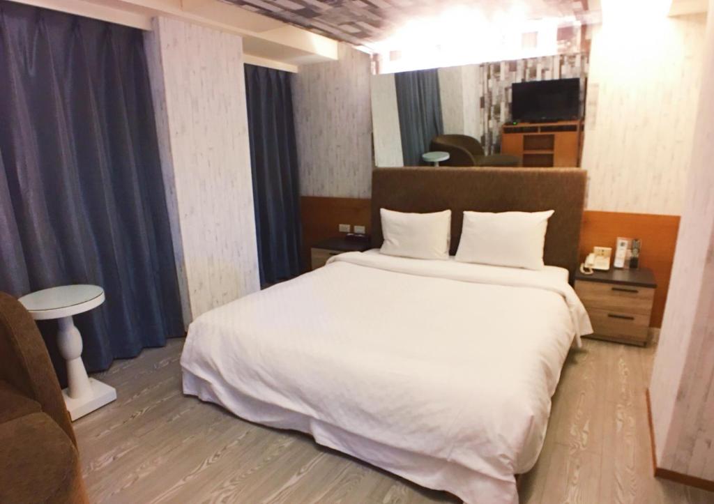 Postel nebo postele na pokoji v ubytování Love Hotel