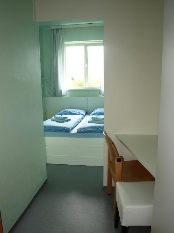 Postel nebo postele na pokoji v ubytování Junges Hotel Melk