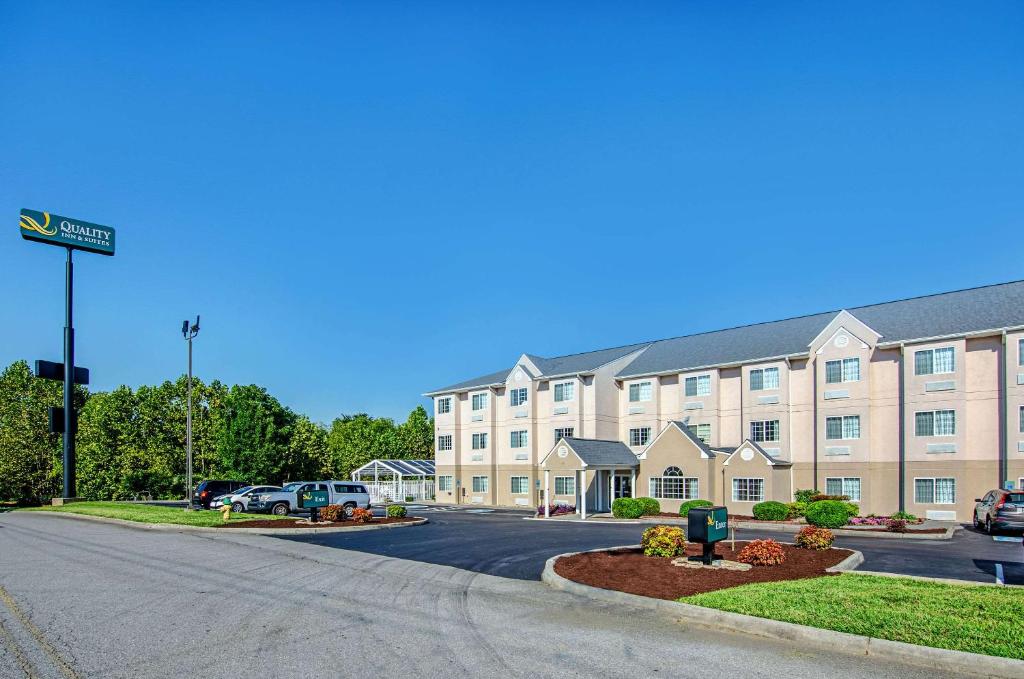 a large building with a street sign in front of it at Quality Inn & Suites I-81 Exit 7 in Bristol