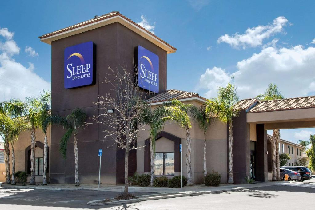 a large building with a clock on the front of it at Sleep Inn & Suites Bakersfield North in Bakersfield
