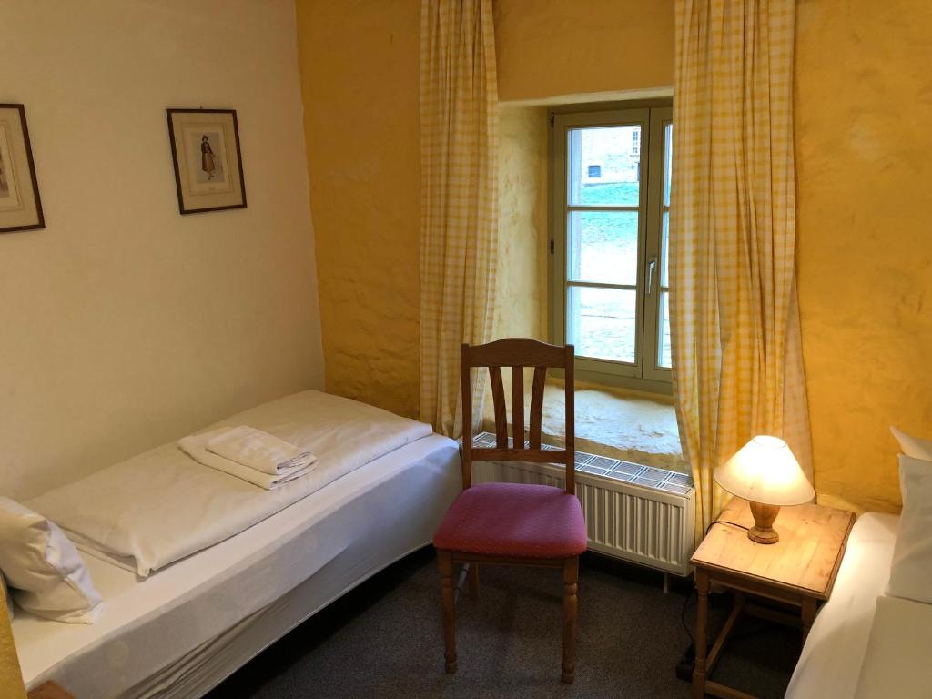 Postel nebo postele na pokoji v ubytování Kloster Hedersleben