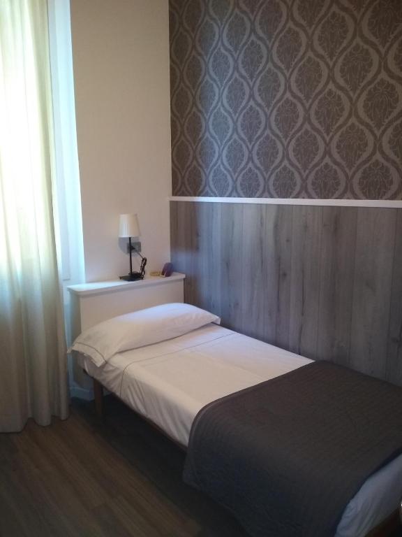 Postel nebo postele na pokoji v ubytování Hotel Malta