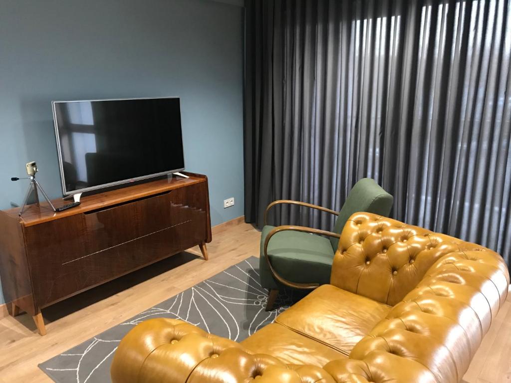 TV a/nebo společenská místnost v ubytování Silesia Apartment Eliza