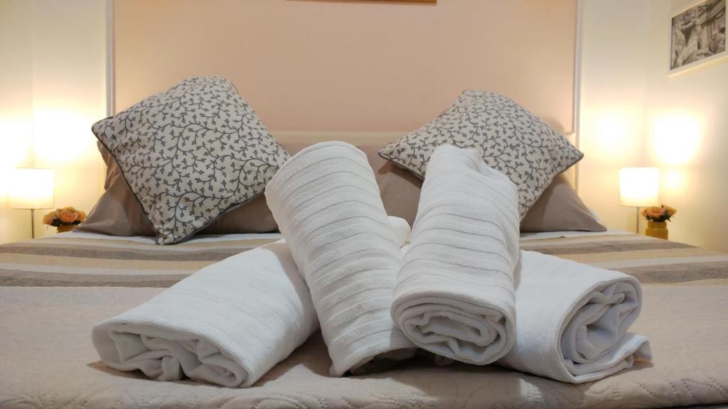 Llit o llits en una habitació de Dreaming Navona Rooms