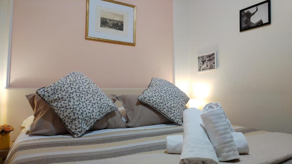 Llit o llits en una habitació de Dreaming Navona Rooms
