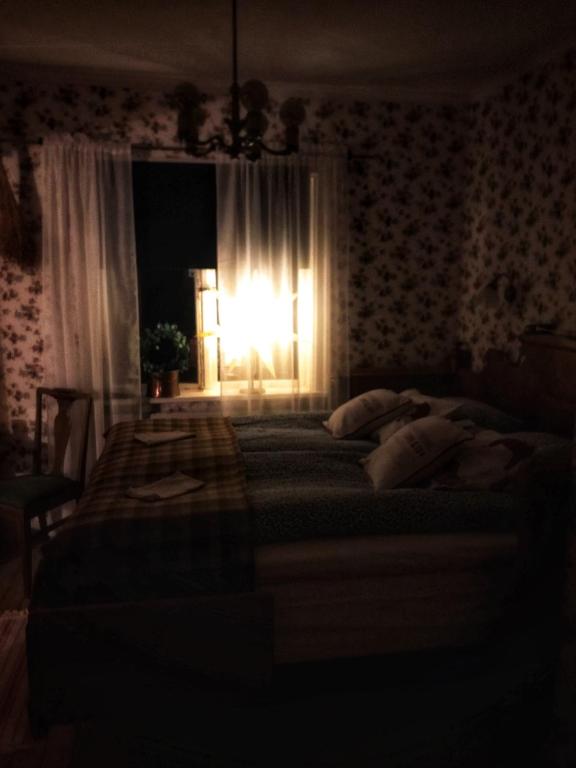 Postel nebo postele na pokoji v ubytování Det Gamla Panget
