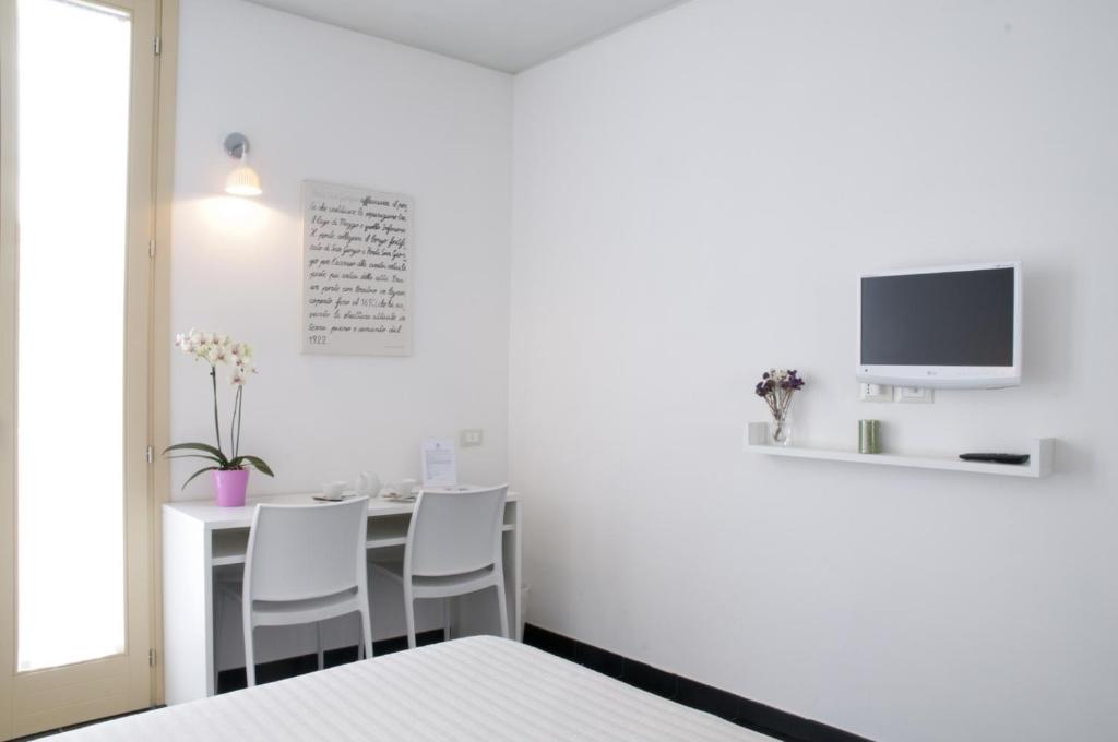 TV a/nebo společenská místnost v ubytování 6 Porte Guesthouse