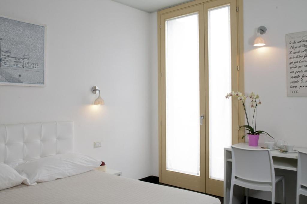 Postel nebo postele na pokoji v ubytování 6 Porte Guesthouse