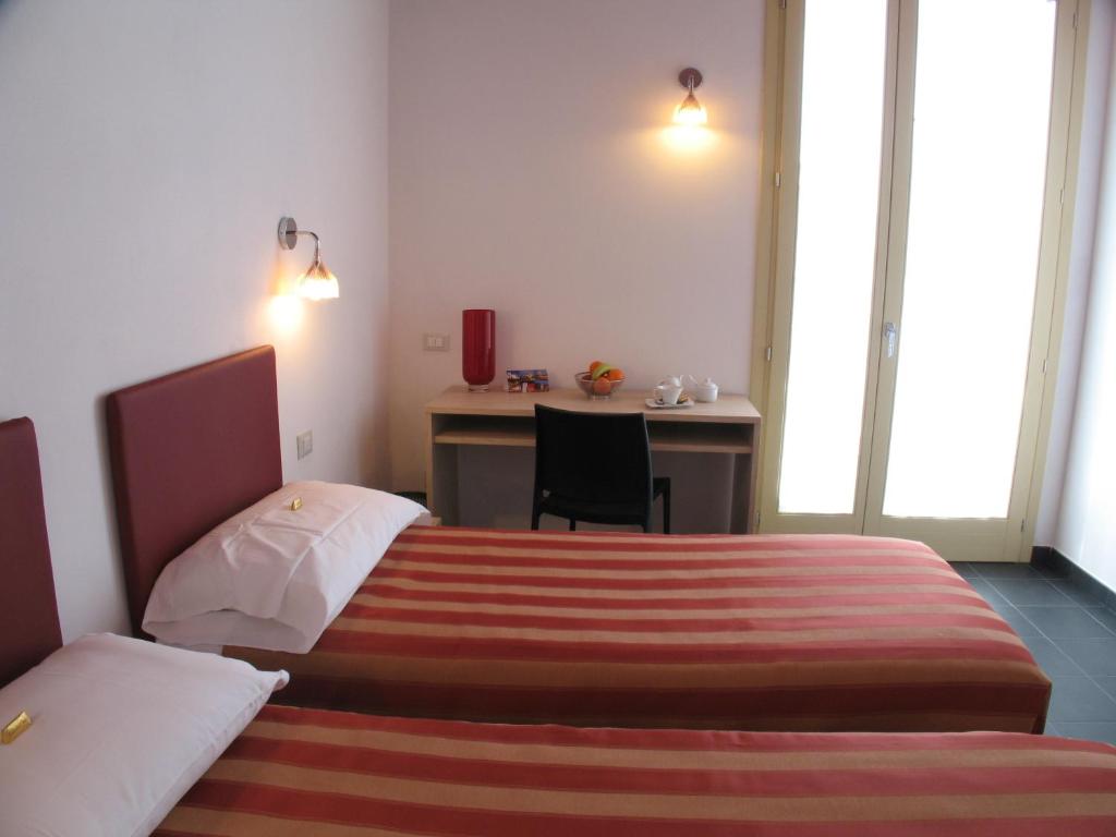 Postel nebo postele na pokoji v ubytování 6 Porte Guesthouse