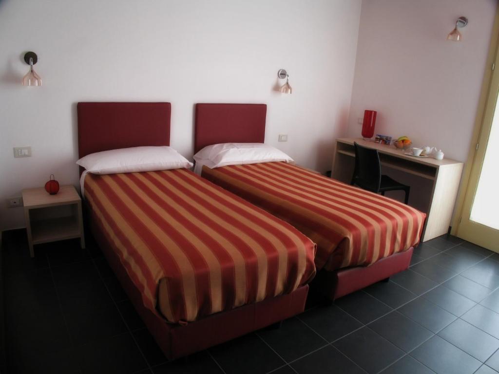 Postel nebo postele na pokoji v ubytování 6 Porte Guesthouse