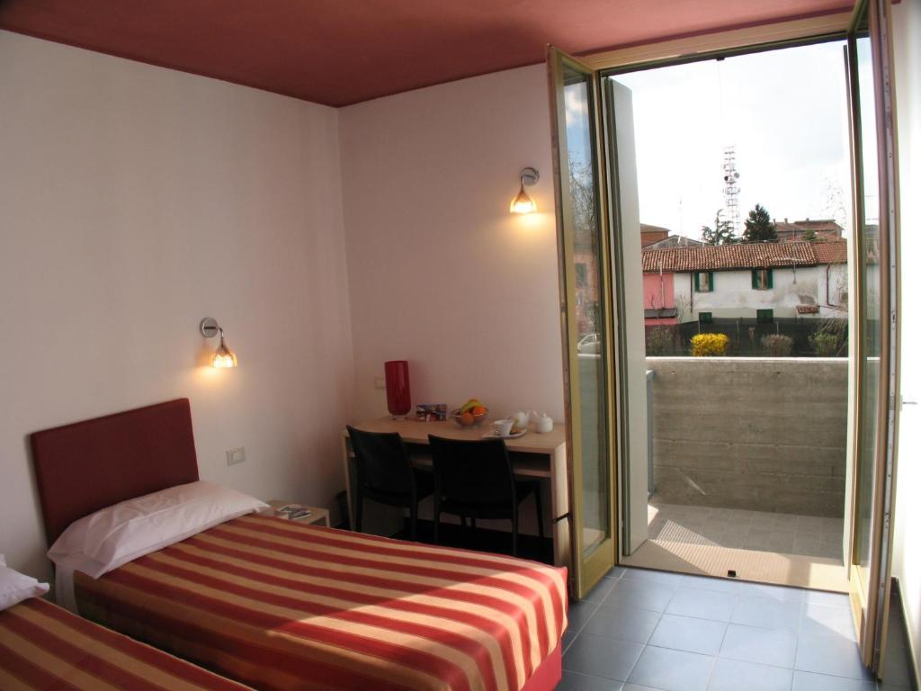 Postel nebo postele na pokoji v ubytování 6 Porte Guesthouse