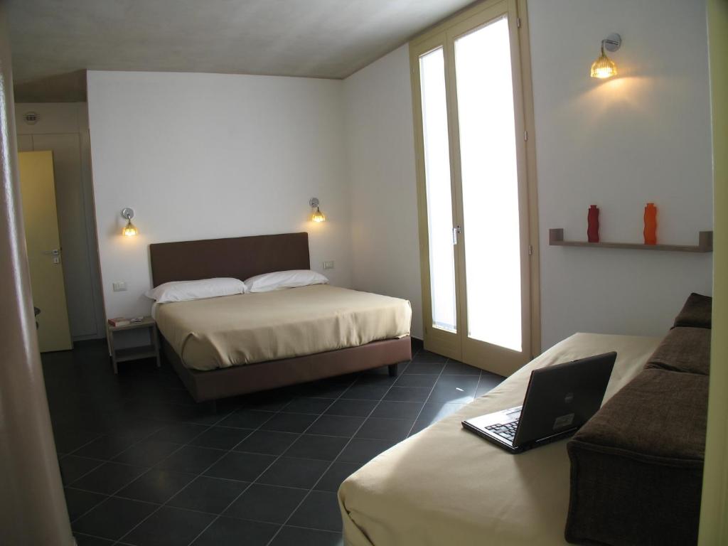 Postel nebo postele na pokoji v ubytování 6 Porte Guesthouse