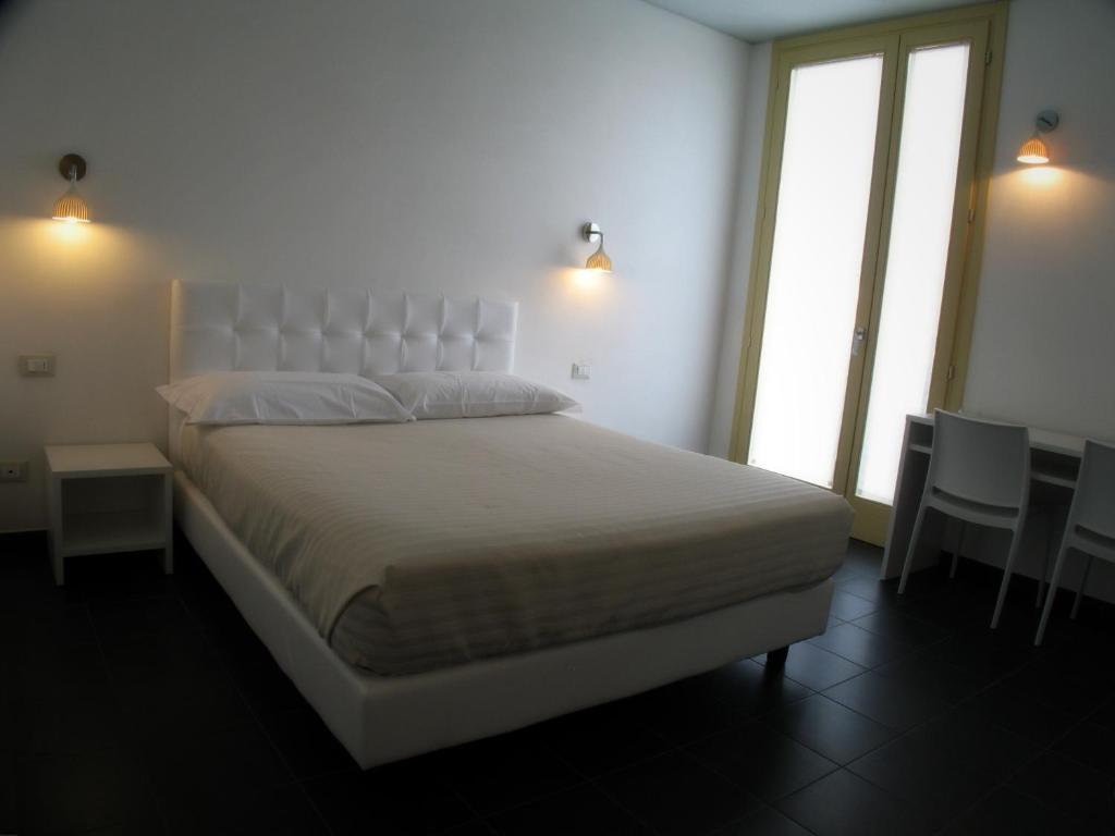 Postel nebo postele na pokoji v ubytování 6 Porte Guesthouse