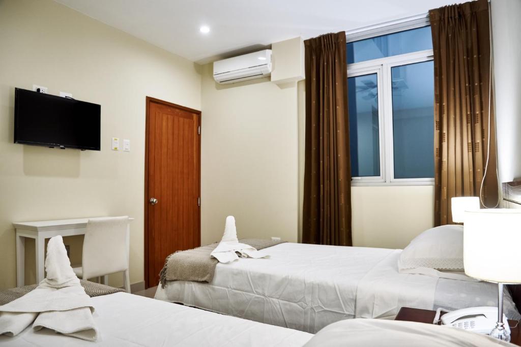 Voodi või voodid majutusasutuse LC Hoteles Piura toas