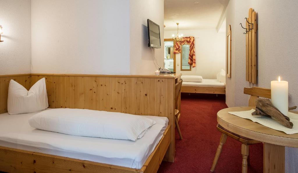Postel nebo postele na pokoji v ubytování Apart Garni Elfrieda
