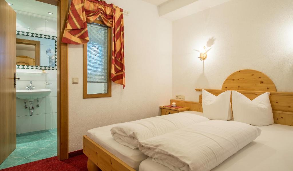 Postel nebo postele na pokoji v ubytování Apart Garni Elfrieda
