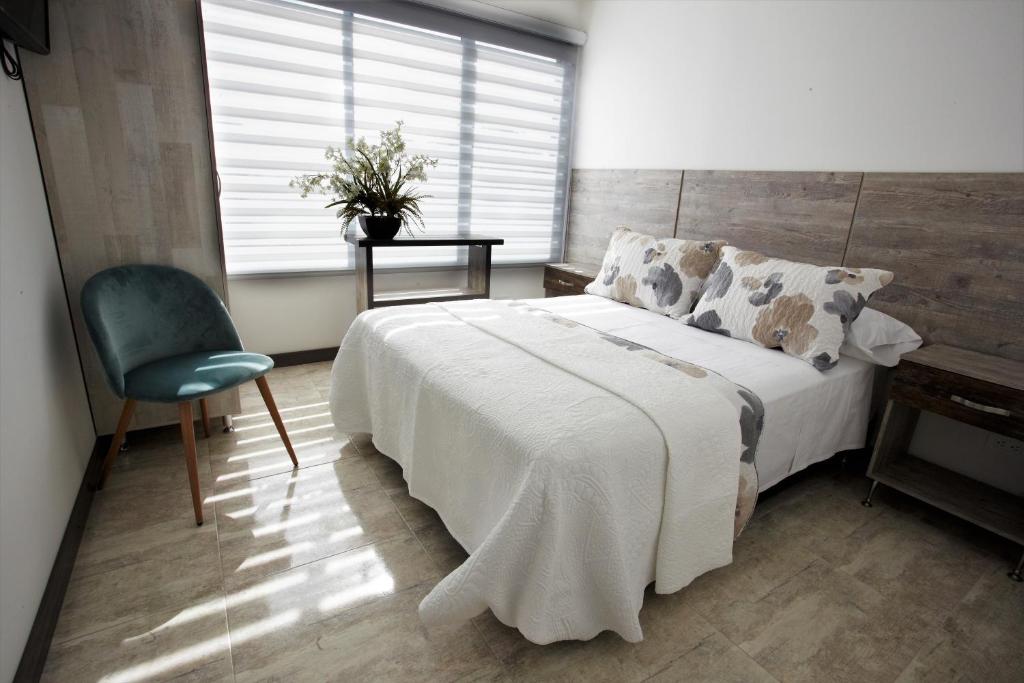 Postel nebo postele na pokoji v ubytování ARI Hotel