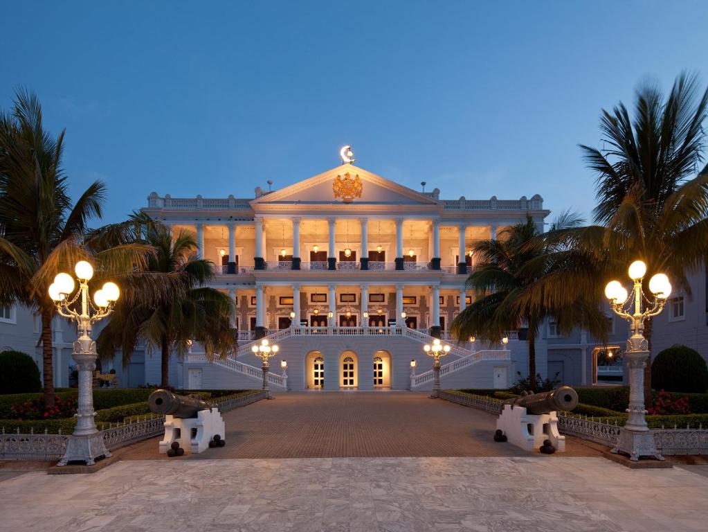 a large white building with a large clock on it at Taj Falaknuma Palace in Hyderabad