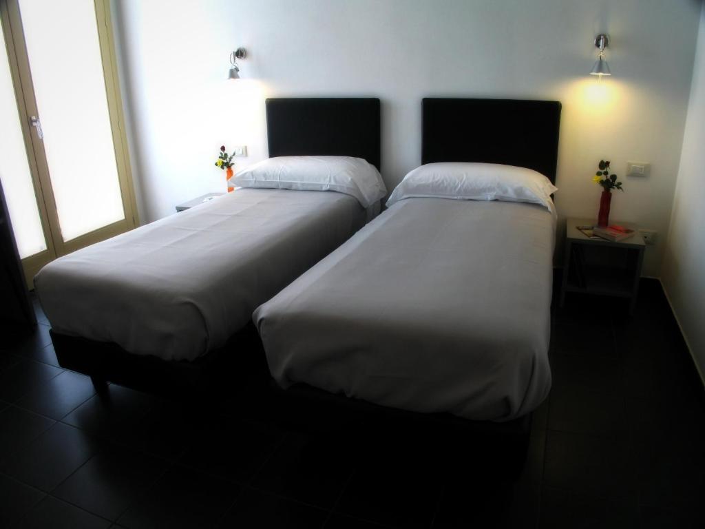 Postel nebo postele na pokoji v ubytování 6 Porte Guesthouse