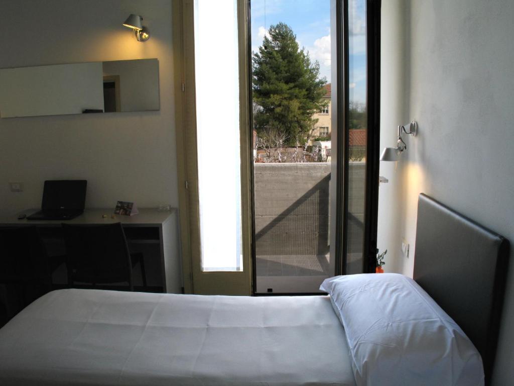 Postel nebo postele na pokoji v ubytování 6 Porte Guesthouse