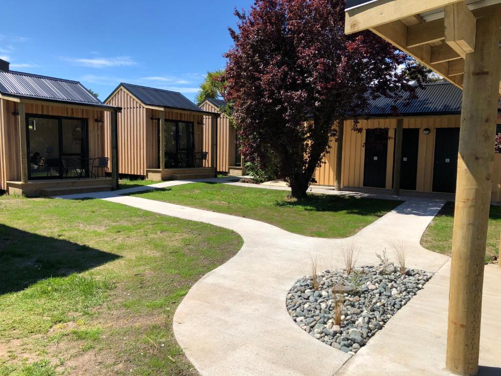 a walkway in front of a building at Te Anau Lakefront Backpackers in Te Anau
