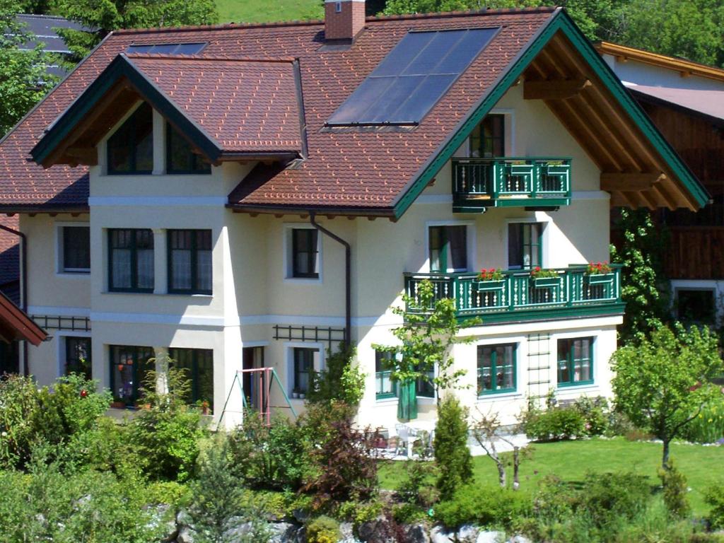 a house with a solar panel on its roof at Haus Ramsauer in Werfenweng