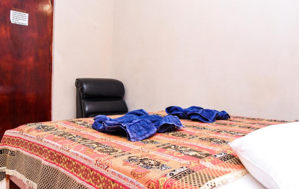 Postel nebo postele na pokoji v ubytování Kandy View Hotel