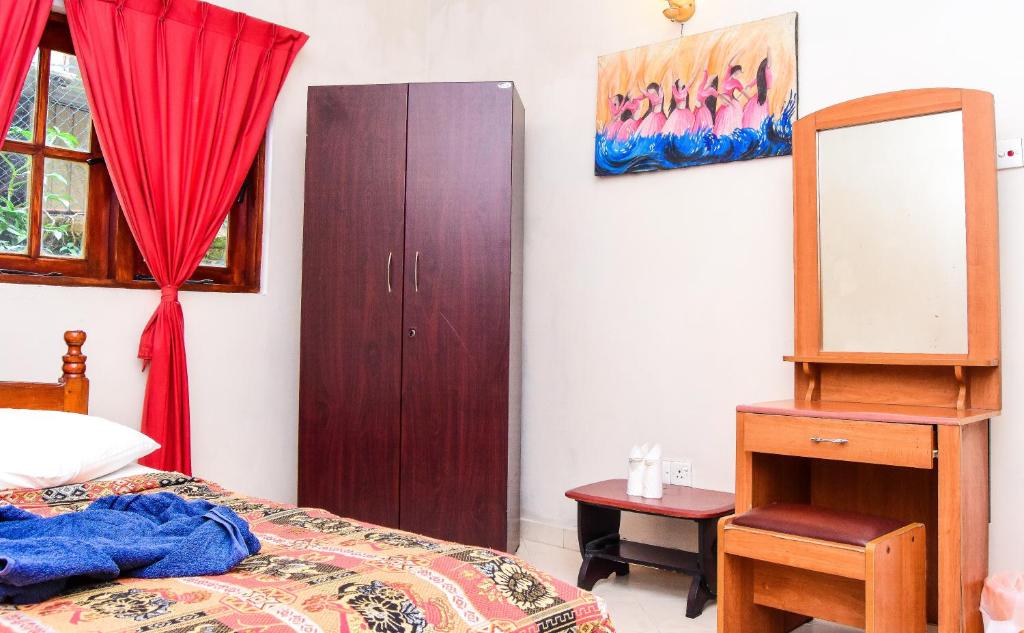 Postel nebo postele na pokoji v ubytování Kandy View Hotel