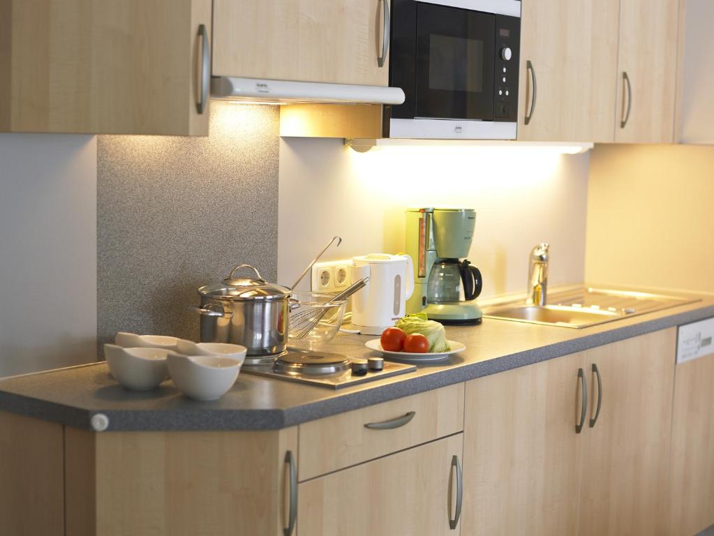 Kuchyň nebo kuchyňský kout v ubytování Apart-Hotel Filomena