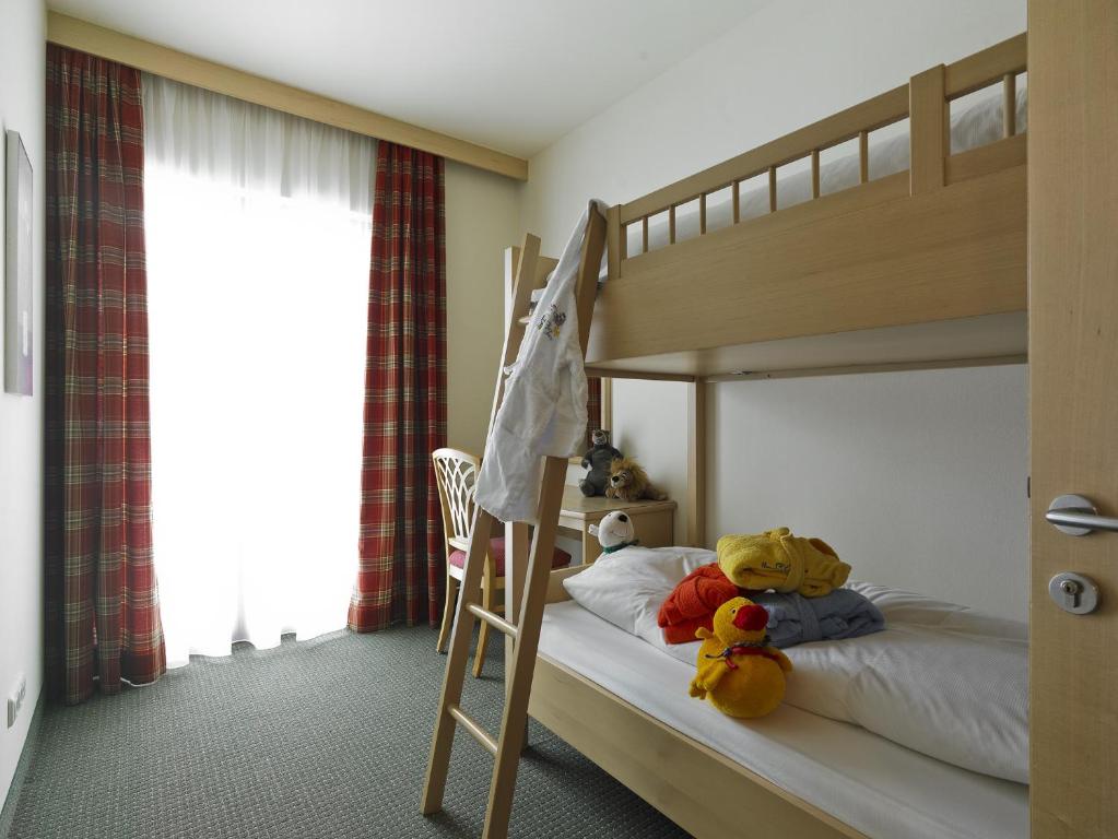 Postel nebo postele na pokoji v ubytování Apart-Hotel Filomena
