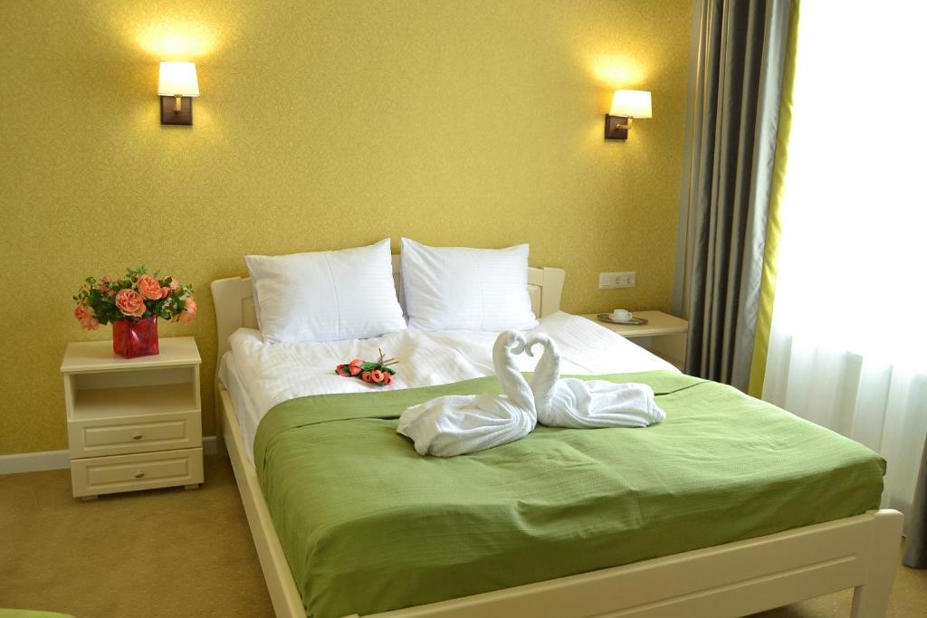 Postel nebo postele na pokoji v ubytování Hotel Ajur