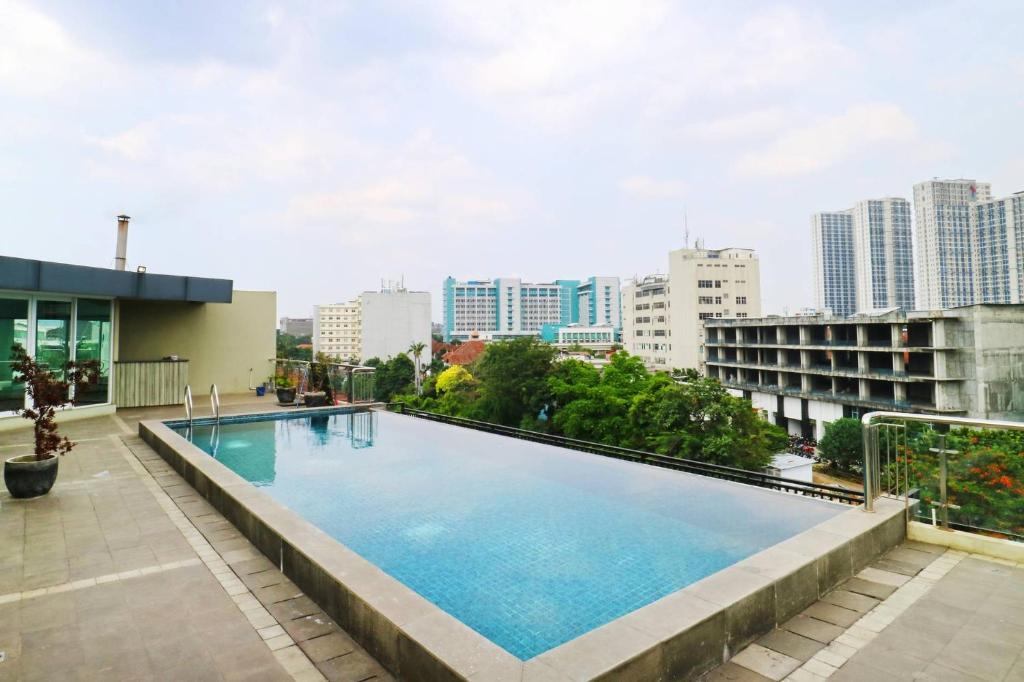 a large swimming pool on the roof of a building at The Baile in Jakarta