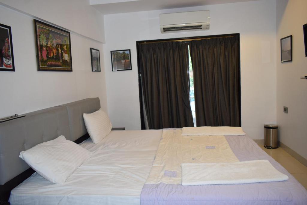Postel nebo postele na pokoji v ubytování Athi Resorts