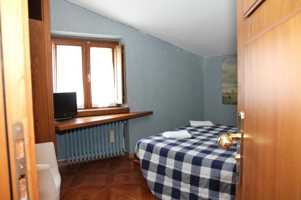 Postel nebo postele na pokoji v ubytování Hotel Da Remo