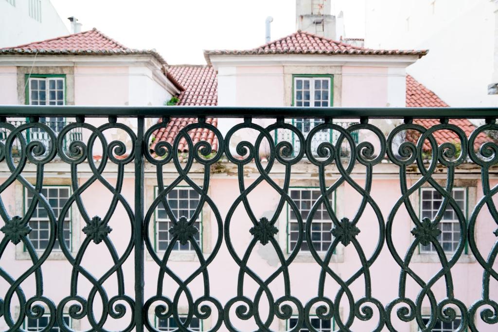 an iron fence in front of a building at Casa Chiado in Lisbon