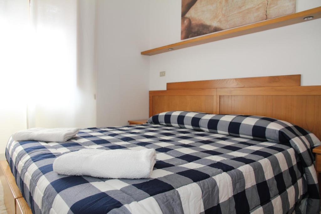 Postel nebo postele na pokoji v ubytování Hotel Da Remo