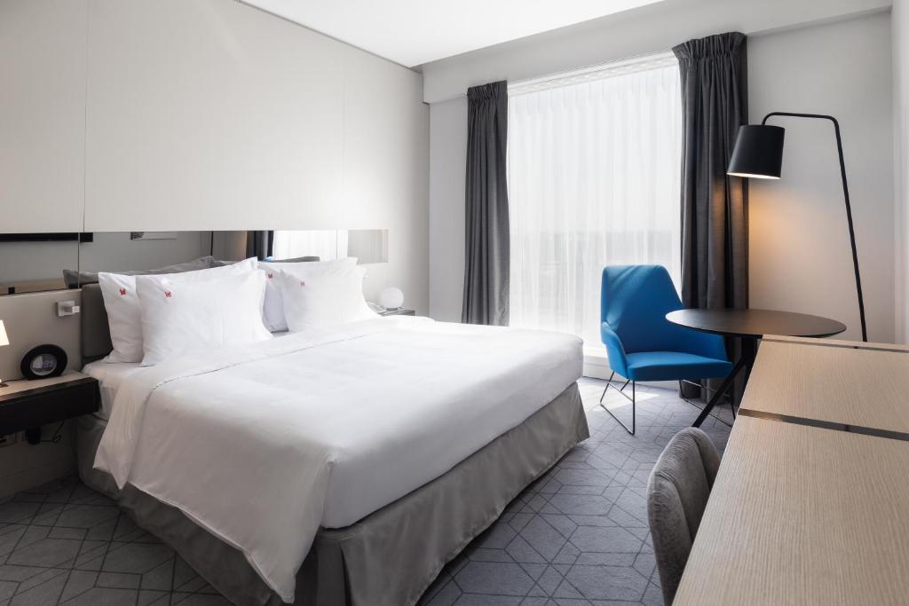Postel nebo postele na pokoji v ubytování Studio M Arabian Plaza Hotel & Hotel Apartments