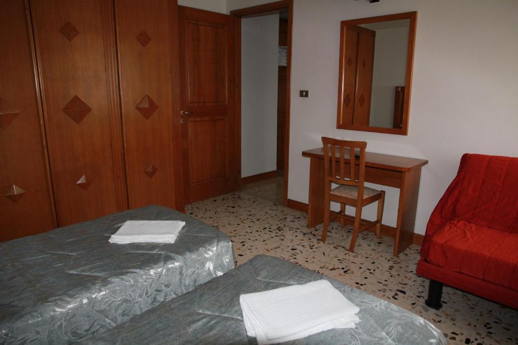 Postel nebo postele na pokoji v ubytování Hotel Da Remo