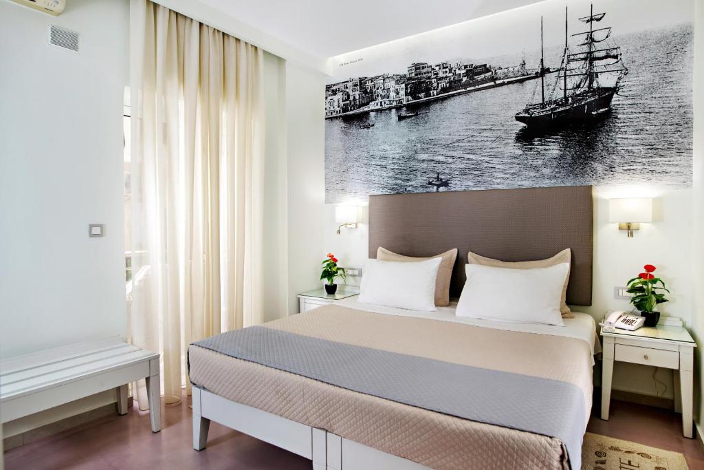 Postel nebo postele na pokoji v ubytování Hotel Ideon