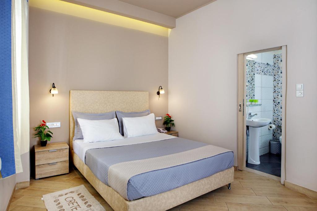 Postel nebo postele na pokoji v ubytování Hotel Ideon