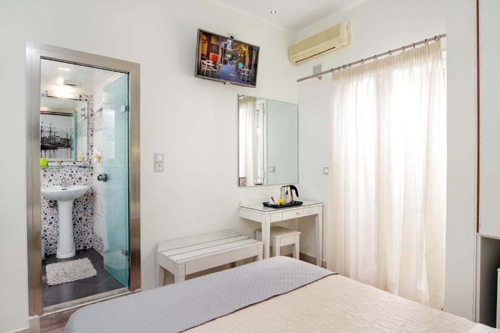 Postel nebo postele na pokoji v ubytování Hotel Ideon