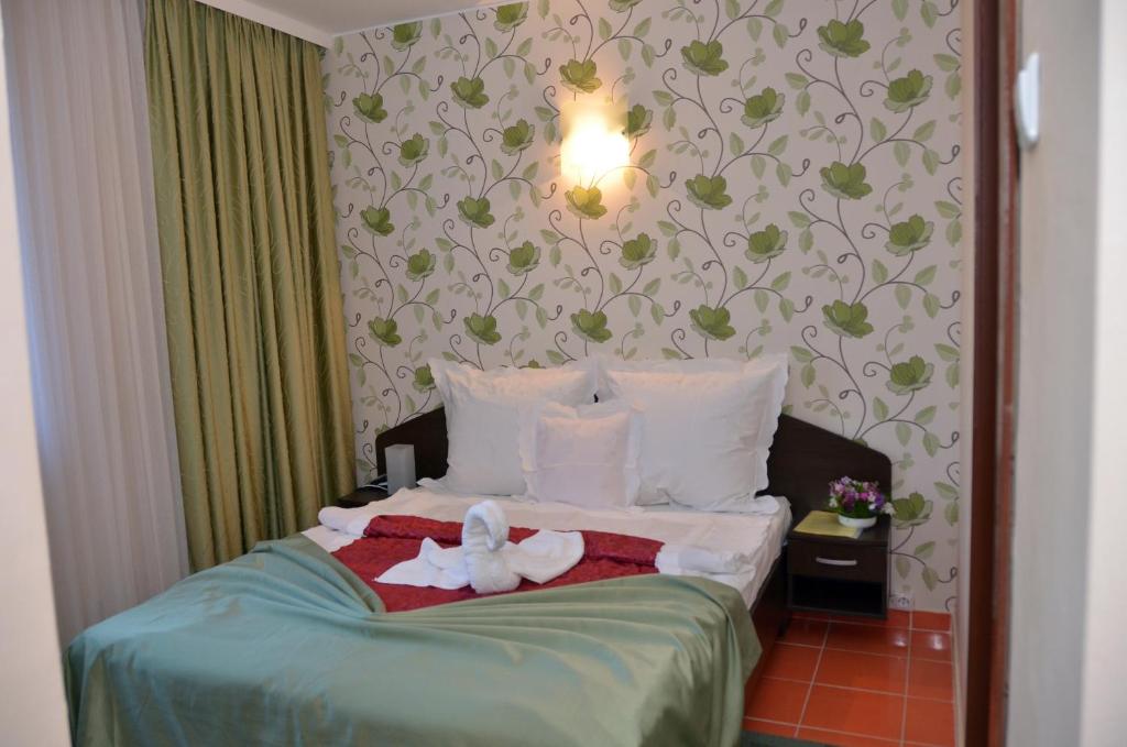 Postel nebo postele na pokoji v ubytování Hotel Turist