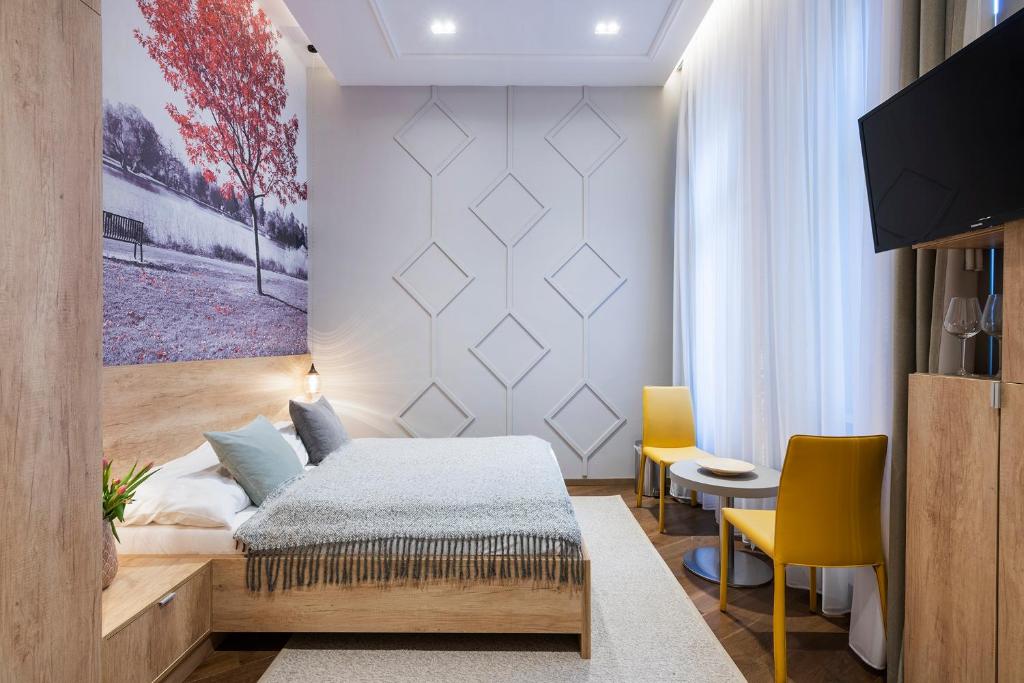 Televízia a/alebo spoločenská miestnosť v ubytovaní Lakeside Budapest Residences