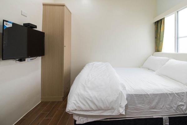 Llit o llits en una habitació de Happiness B&B