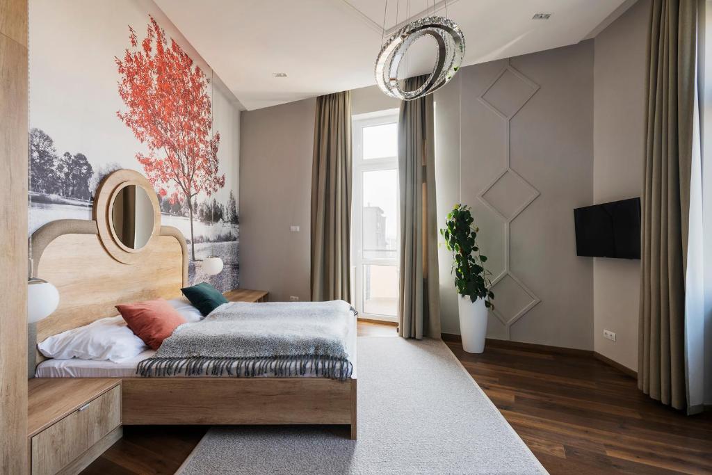 Posteľ alebo postele v izbe v ubytovaní Lakeside Budapest Residences