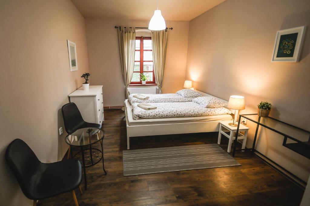 Postel nebo postele na pokoji v ubytování Statek Jakubov